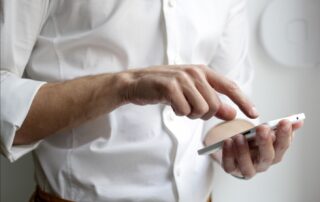 Man using fingers to operate a phone