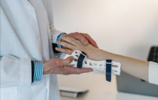 Occupational hand therapist fitting a cast on a sprained hand