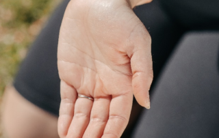 Photo of a person touching their wrist