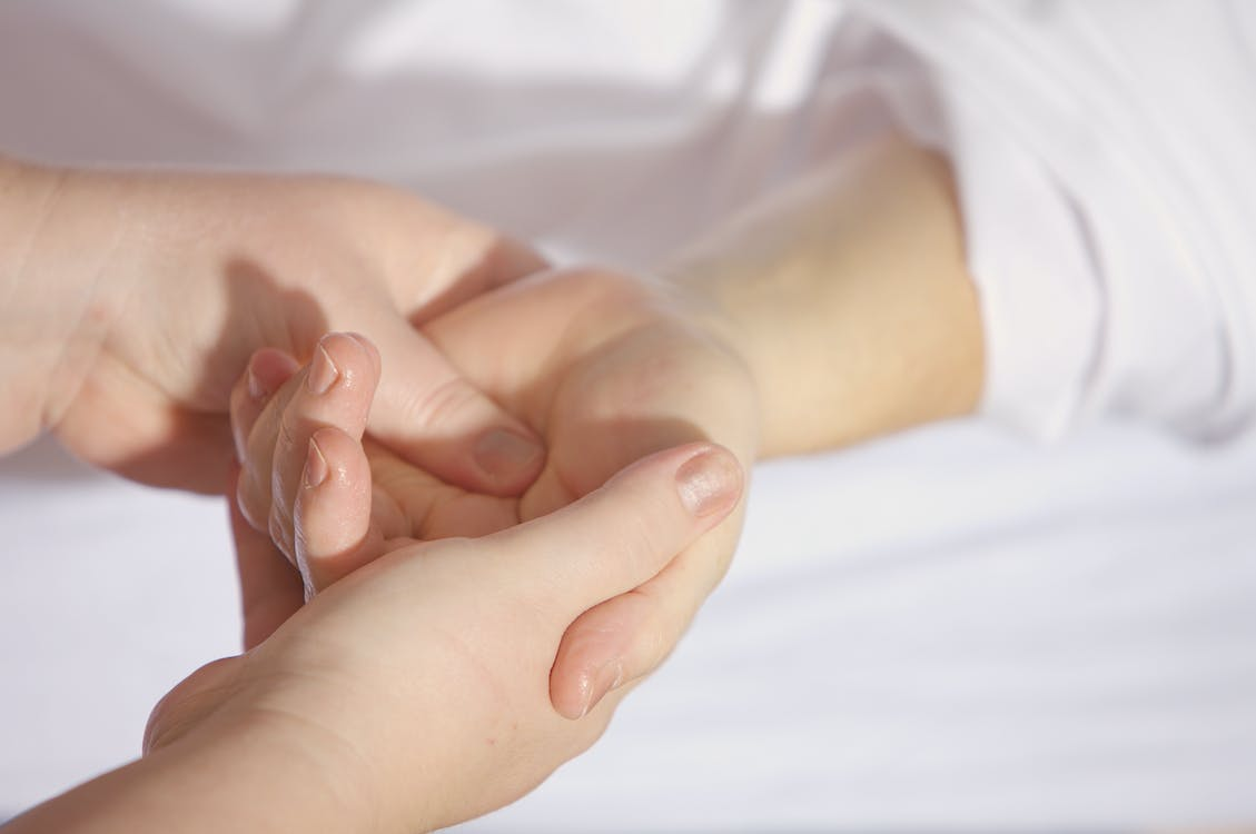  a person pressing another's hand